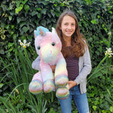 Large Rainbow Unicorn and Donated Stuffed Animal